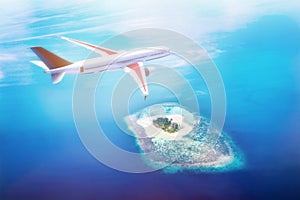 Airplane flying over Maldives islands on Indian Ocean. Travel