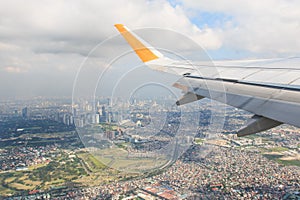 Airplane flying over Manila, Philippines