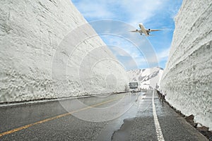 Airplane flying over Tateyama Kurobe Alpine Route, Toyama Prefecture, Japan photo