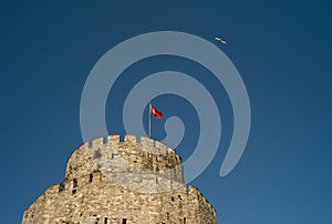 Airplane Flying over the Tower of a Castle