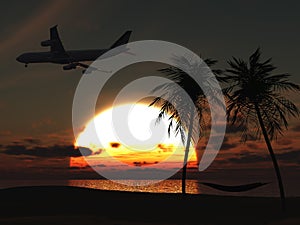 Airplane flying over tropical beach at sunset.