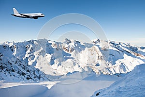 Airplane Flying In Sky Against Snowcapped Mountains