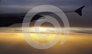 Airplane flying, sunset.