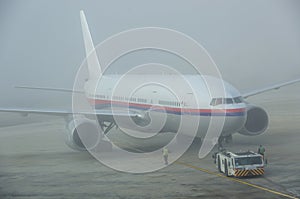 Airplane in a foggy day