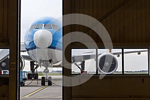 Airplane in front of hangar