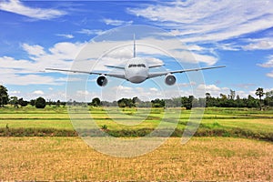 Airplane frying over the green rice flied Mountain background photo
