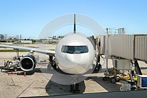 Airplane at the gate, ready for boarding.