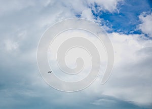 Airplane high speed on the clouds sky.