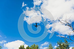 Airplane high speed on the clouds sky.