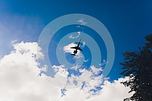 Airplane high speed on the clouds sky.