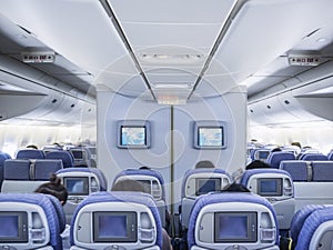 Airplane Interior flight on board with Passenger seat row screen monitor