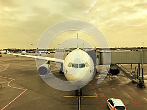 Airplane with jet bridge at airport