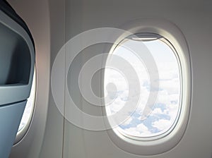 Airplane or jet interior with window and chair