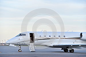 A airplane jet stay on the airport runway.