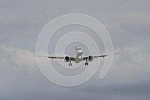 Airplane Jetliner arriving at airport runway photo