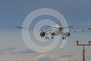 Airplane Jetliner arriving at airport runway photo