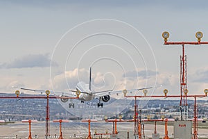 Airplane Jetliner arriving at airport runway photo