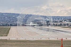Airplane Jetliner departing at airport runway photo