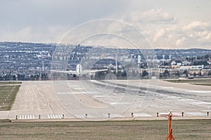 Airplane Jetliner departing at airport runway photo