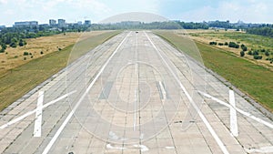 Airplane landing on airport runway. POV aerial shot