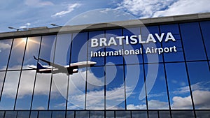 Airplane landing at Bratislava mirrored in terminal