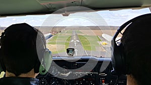 Airplane student and flight instructor landing on runway