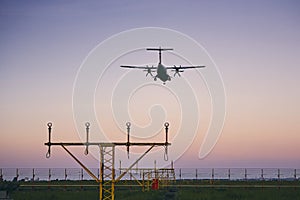 Airplane landing at dusk