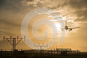 Airplane landing at dusk.