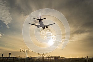 Airplane landing at dusk.