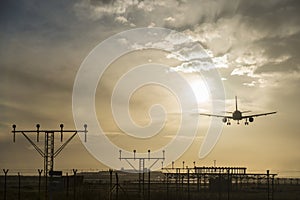 Airplane landing at dusk.