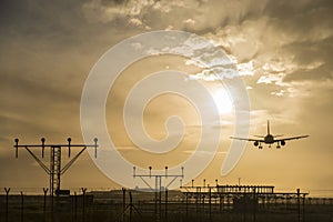 Airplane landing at dusk.