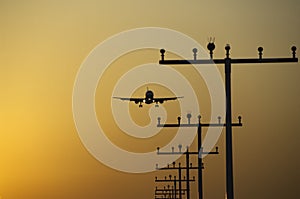 Airplane landing at frankfurt airport at sunrise