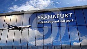 Airplane landing at Frankfurt mirrored in terminal