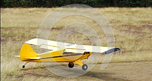 Airplane landing in grass