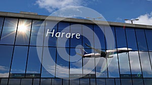 Airplane landing at Harare Zimbabwe airport mirrored in terminal