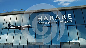 Airplane landing at Harare Zimbabwe airport mirrored in terminal