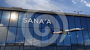 Airplane landing at Sana`a, Sanaa Yemen airport mirrored in terminal