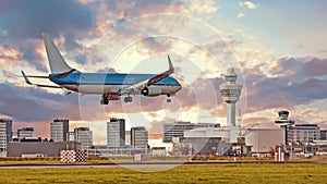 Airplane landing on Schiphol airport in Netherlands at sunset - Cinemagraph