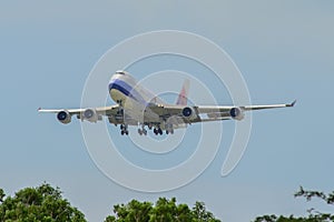 Airplane landing at Singapore Airport photo