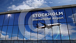 Airplane landing at Stockholm mirrored in terminal