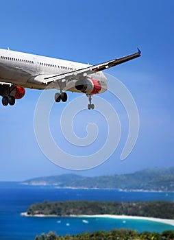 Airplane landing on tropical country