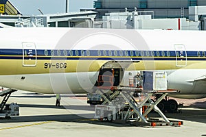 An Airplane Loading Air Cargo Containers After Flight At Changi Airport, Singapore.