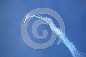 Airplane looping the loop with a vapour trail