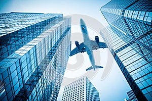 Airplane and modern office building