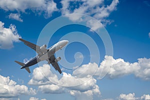 Airplane over the clouds photo