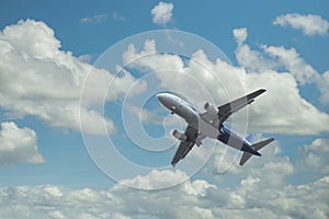 Airplane over the clouds photo