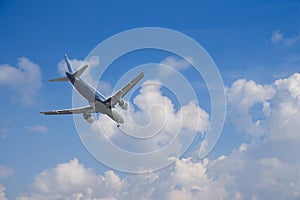 Airplane over the clouds photo