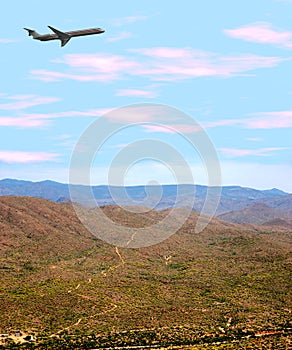 Airplane Over Desert