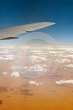 Airplane over Sahara desert