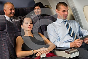 Airplane passenger relax during flight cabin sleep